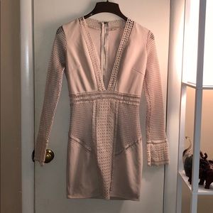 Plunging mini dress with fishnet details